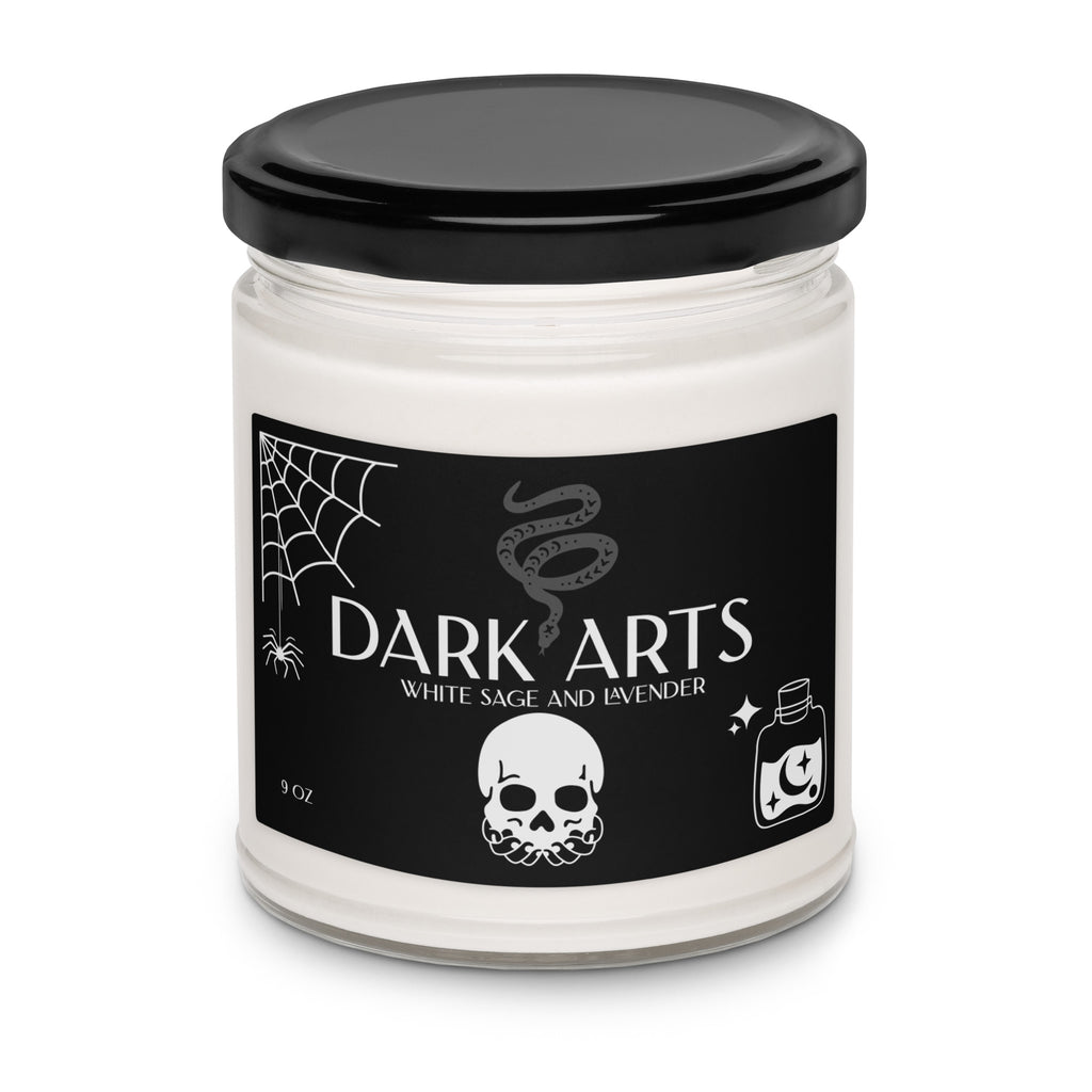 Candle jar labeled 'Dark Arts' with a black lid and black label featuring white text and graphics.