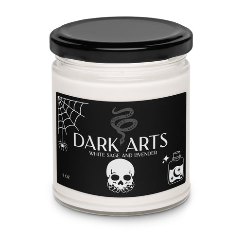 Candle jar labeled 'Dark Arts' with a black lid and black label featuring white text and graphics.