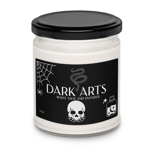 Candle jar labeled 'Dark Arts' with a black lid and black label featuring white text and graphics.